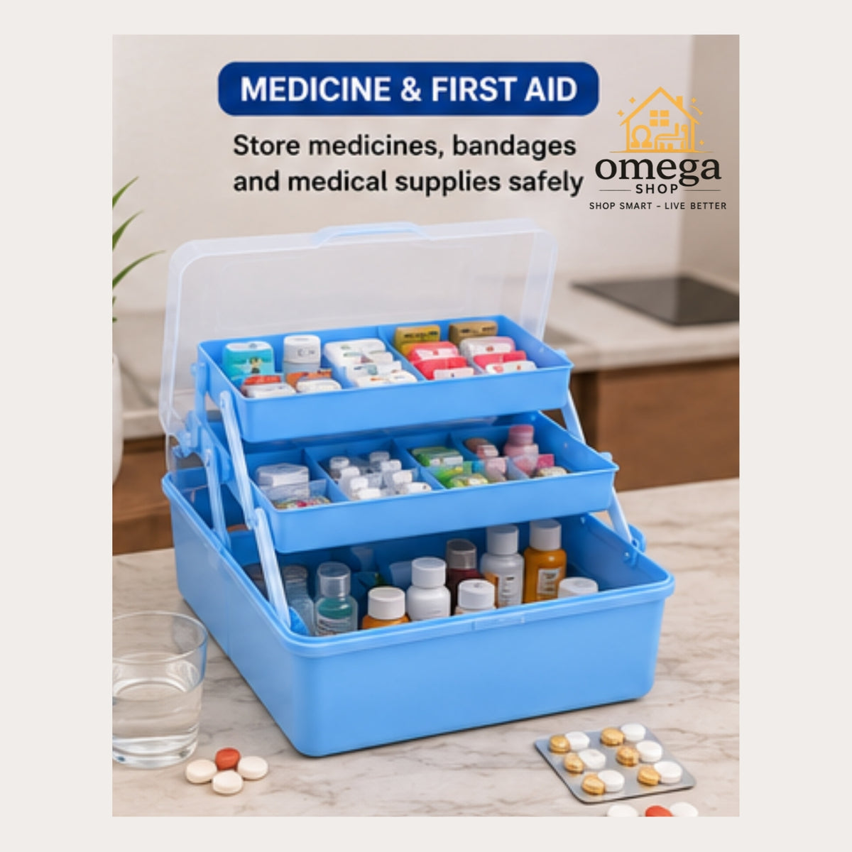 A blue medicine and first aid storage box with a clear lid, shown open and filled with assorted pills, vials, and bandages on a countertop. Text at the top reads 'MEDICINE & FIRST AID' and includes the Omega Shop logo.
