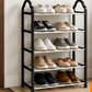 A 5-tier shoe rack with a black metal frame and white slatted shelves, shown holding various casual shoes and sneakers. The rack is positioned against a beige wall with some text overlays at the top.