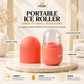 A portable ice roller set by Omega Shop shown on a marble pedestal in a styled bathroom-like setting. The set includes a ribbed coral-pink container with a clear domed top and a matching ribbed cover.