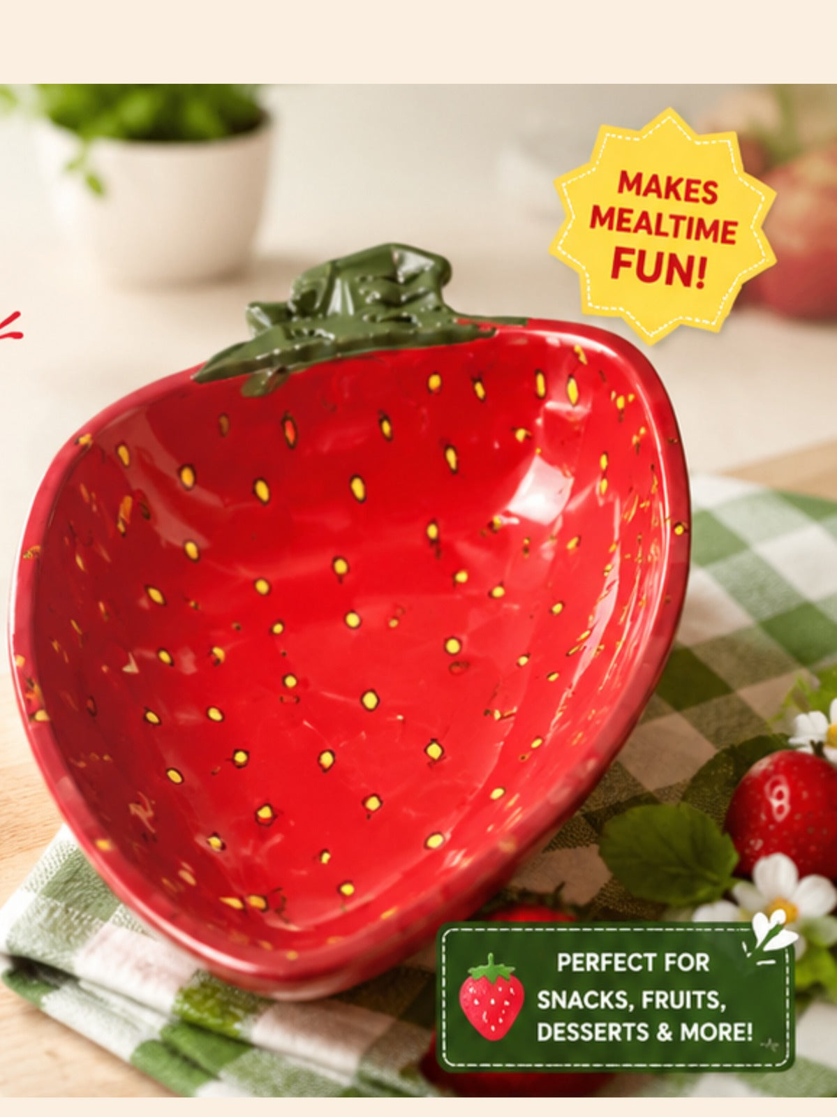Strawberry-shaped bowl with a checkered tablecloth and potted plant in the background
