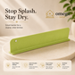A lime green silicone kitchen splash guard by Omega Shop, displayed on a round pedestal with promotional text and feature icons at the bottom.