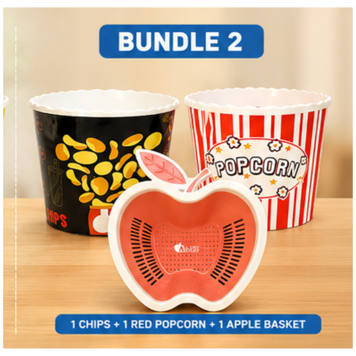 A product bundle set featuring three snack containers: a black cup with yellow chips, a red-and-white striped popcorn bucket, and a red apple-shaped basket in the foreground. Blue text banners at the top and bottom read 'BUNDLE 2' and '1 CHIPS + 1 RED POPCORN + 1 APPLE BASKET'.