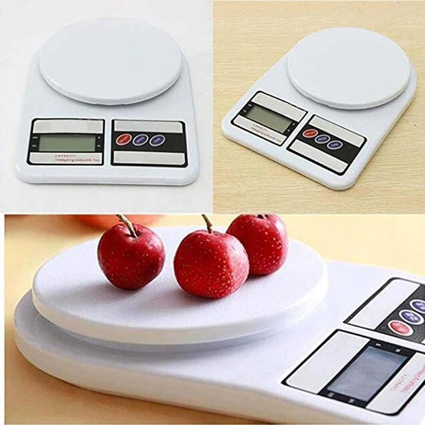 Digital kitchen scale with a platform showing apples on a wooden surface