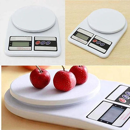 Digital kitchen scale with a platform showing apples on a wooden surface
