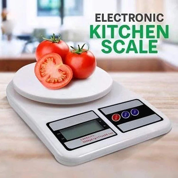 Electronic kitchen scale with tomatoes on a wooden surface