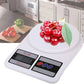 Digital kitchen scale with cherries on a kitchen counter